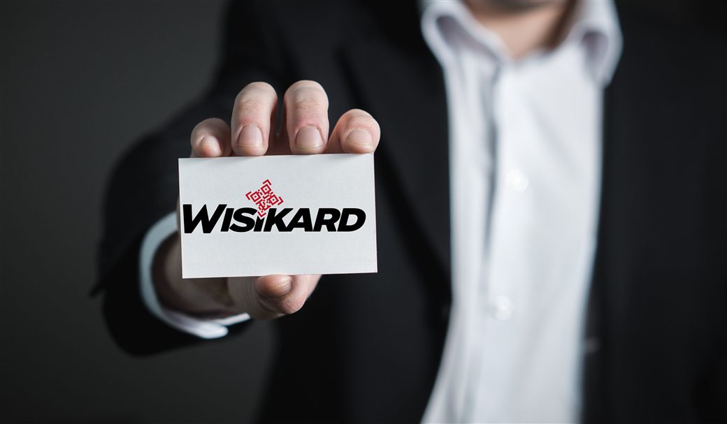Professional presenting their Wisikard digital business card with QR Code